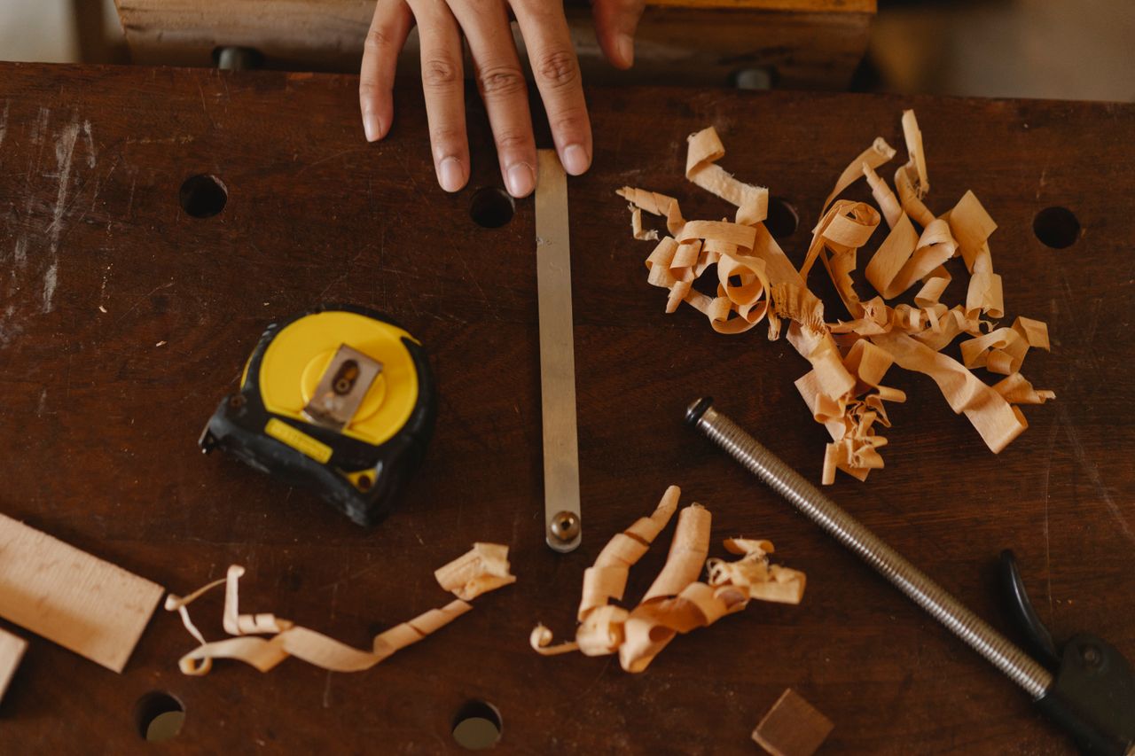 Crafting Captivating Headlines: Your awesome post title goes here From above of crop anonymous woodworker with assorted instruments and wooden shavings in workshop